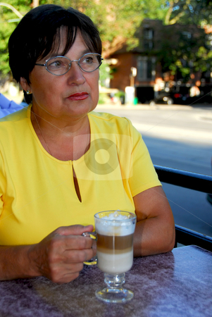 To use this stock image in your creative project, please select the size you need over to the right and click the "Add to Cart" button.
Your downloaded image will come with the Cutcaster watermark removed so don’t worry about the watermark you see on this page. Mature woman coffee stock photo, Mature woman in outdoor cafe with coffee looking sad by Elena Elisseeva