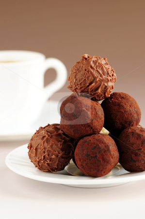 To use this stock image in your creative project, please select the size you need over to the right and click the "Add to Cart" button.
Your downloaded image will come with the Cutcaster watermark removed so don’t worry about the watermark you see on this page. Chocolate truffles and coffee stock photo, Gourmet chocolate truffles on a plate with a cup of coffee by Elena Elisseeva