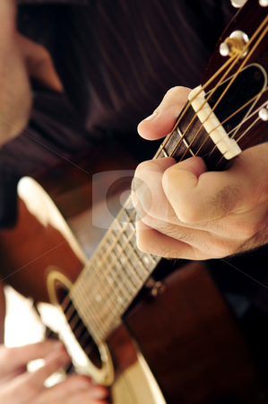 To use this stock image in your creative project, please select the size you need over to the right and click the "Add to Cart" button.
Your downloaded image will come with the Cutcaster watermark removed so don’t worry about the watermark you see on this page. Man playing a guitar stock photo, Man playing a musical instrument accoustic guitar by Elena Elisseeva