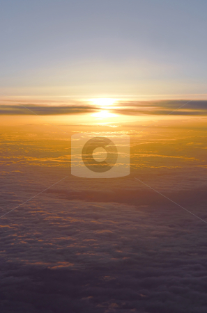 To use this stock image in your creative project, please select the size you need over to the right and click the "Add to Cart" button.
Your downloaded image will come with the Cutcaster watermark removed so don’t worry about the watermark you see on this page. Above the clouds stock photo, Spectacular view of a sunset above the clouds from airplane window by Elena Elisseeva