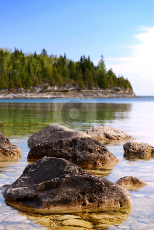 To use this stock image in your creative project, please select the size you need over to the right and click the "Add to Cart" button.
Your downloaded image will come with the Cutcaster watermark removed so don’t worry about the watermark you see on this page. Lake landscape stock photo, Rocks in clear water of Georgian Bay at Bruce peninsula Ontario Canada by Elena Elisseeva