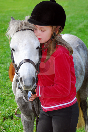 To use this stock image in your creative project, please select the size you need over to the right and click the "Add to Cart" button.
Your downloaded image will come with the Cutcaster watermark removed so don’t worry about the watermark you see on this page. Girl and pony stock photo, Young girl with a white pony at countryside by Elena Elisseeva