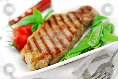 To use this stock image in your creative project, please select the size you need over to the right and click the "Add to Cart" button.
Your downloaded image will come with the Cutcaster watermark removed so don’t worry about the watermark you see on this page. Grilled steak stock photo, Grilled New York beef steak served on a plate with vegetables by Elena Elisseeva