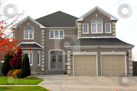 To use this stock image in your creative project, please select the size you need over to the right and click the "Add to Cart" button.
Your downloaded image will come with the Cutcaster watermark removed so don’t worry about the watermark you see on this page. House stock photo, New detached single family luxury home with stone facade by Elena Elisseeva