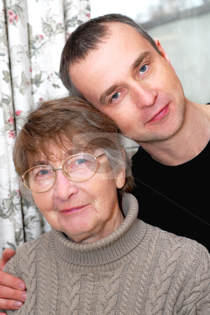 To use this stock image in your creative project, please select the size you need over to the right and click the "Add to Cart" button.
Your downloaded image will come with the Cutcaster watermark removed so don’t worry about the watermark you see on this page. Mother and son stock photo, Portrait of a retired mother and her son by Elena Elisseeva