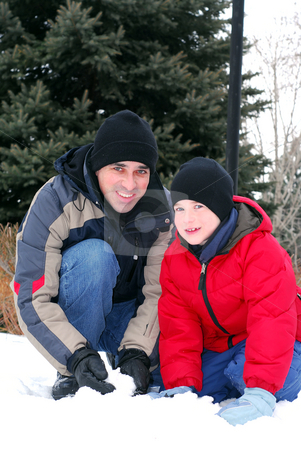 To use this stock image in your creative project, please select the size you need over to the right and click the "Add to Cart" button.
Your downloaded image will come with the Cutcaster watermark removed so don’t worry about the watermark you see on this page. Father and son stock photo, Portrait of father and son playing in winter park by Elena Elisseeva