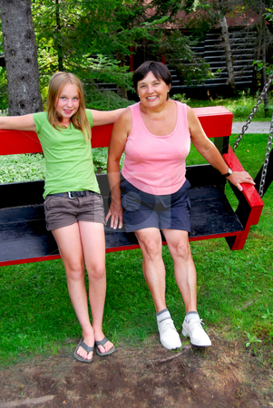 To use this stock image in your creative project, please select the size you need over to the right and click the "Add to Cart" button.
Your downloaded image will come with the Cutcaster watermark removed so don’t worry about the watermark you see on this page. Family on swings stock photo, Grandmother and granddaughter on swings by Elena Elisseeva