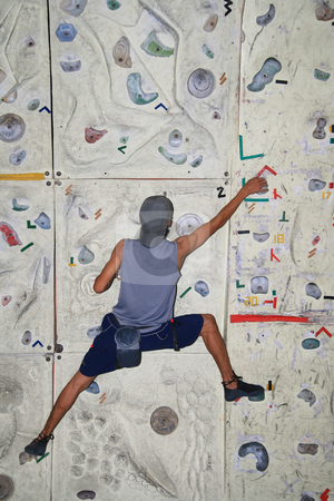 To use this stock image in your creative project, please select the size you need over to the right and click the "Add to Cart" button.
Your downloaded image will come with the Cutcaster watermark removed so don’t worry about the watermark you see on this page. Rock climber stock photo, Male rock climber inside an indoor rock climbing wall by Jonas Marcos San Luis