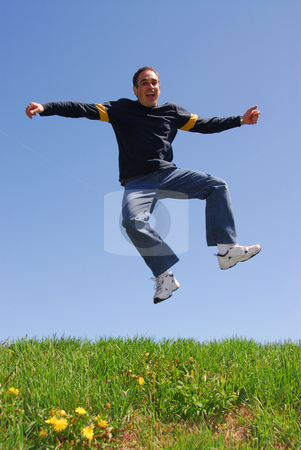 To use this stock image in your creative project, please select the size you need over to the right and click the "Add to Cart" button.
Your downloaded image will come with the Cutcaster watermark removed so don’t worry about the watermark you see on this page. Man jump happy stock photo, Man jumping in joy by Elena Elisseeva