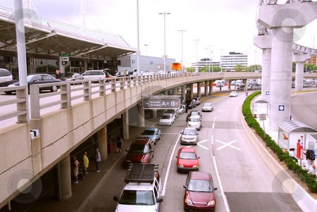 To use this stock image in your creative project, please select the size you need over to the right and click the "Add to Cart" button.
Your downloaded image will come with the Cutcaster watermark removed so don’t worry about the watermark you see on this page. Airport terminal stock photo, Travelers getting taxis at arrival area of airport by Elena Elisseeva