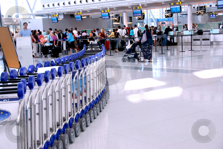 To use this stock image in your creative project, please select the size you need over to the right and click the "Add to Cart" button.
Your downloaded image will come with the Cutcaster watermark removed so don’t worry about the watermark you see on this page. Airport crowd stock photo, Passengers lining up at the check-in counter at the modern international airport by Elena Elisseeva