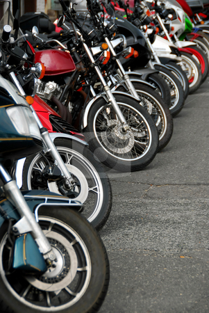 To use this stock image in your creative project, please select the size you need over to the right and click the "Add to Cart" button.
Your downloaded image will come with the Cutcaster watermark removed so don’t worry about the watermark you see on this page. Row of motobikes stock photo, Row of motocycles parked on a street in front a motorcycle store by Elena Elisseeva
