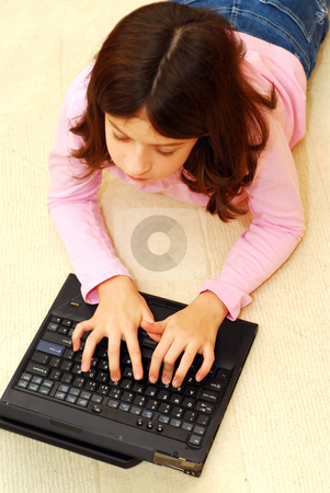 To use this stock image in your creative project, please select the size you need over to the right and click the "Add to Cart" button.
Your downloaded image will come with the Cutcaster watermark removed so don’t worry about the watermark you see on this page. Girl computer stock photo, Young girl lying on the floor with portable computer by Elena Elisseeva