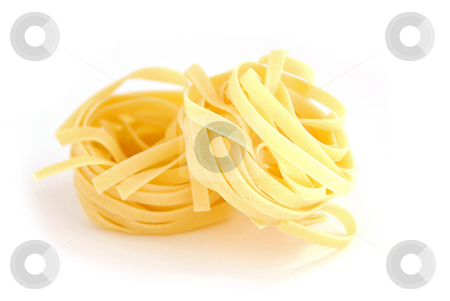 To use this stock image in your creative project, please select the size you need over to the right and click the "Add to Cart" button.
Your downloaded image will come with the Cutcaster watermark removed so don’t worry about the watermark you see on this page. Pasta close stock photo, Fettuccini nests on white background by Elena Elisseeva
