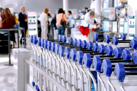 To use this stock image in your creative project, please select the size you need over to the right and click the "Add to Cart" button.
Your downloaded image will come with the Cutcaster watermark removed so don’t worry about the watermark you see on this page. Passengers carts airport stock photo, Luggage carts at modern international airport passengers at check-in counter in the background by Elena Elisseeva