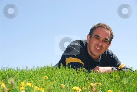To use this stock image in your creative project, please select the size you need over to the right and click the "Add to Cart" button.
Your downloaded image will come with the Cutcaster watermark removed so don’t worry about the watermark you see on this page. Man on grass stock photo, Smiling man lying on grass on background of blue sky by Elena Elisseeva