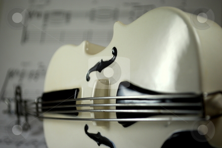 To use this stock image in your creative project, please select the size you need over to the right and click the "Add to Cart" button.
Your downloaded image will come with the Cutcaster watermark removed so don’t worry about the watermark you see on this page. Bass on sheet music angled stock photo, Bass on sheet music background angled by Robert Cabrera
