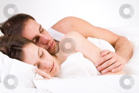 To use this stock image in your creative project, please select the size you need over to the right and click the "Add to Cart" button.
Your downloaded image will come with the Cutcaster watermark removed so don’t worry about the watermark you see on this page. Sleeping toghether stock photo, Young adult couple in the studio sleeping by Frenk and Danielle Kaufmann