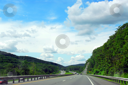To use this stock image in your creative project, please select the size you need over to the right and click the "Add to Cart" button.
Your downloaded image will come with the Cutcaster watermark removed so don’t worry about the watermark you see on this page. Highway stock photo, Divided highway among green rolling hills by Elena Elisseeva