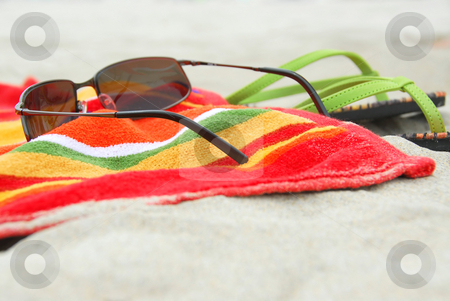 To use this stock image in your creative project, please select the size you need over to the right and click the "Add to Cart" button.
Your downloaded image will come with the Cutcaster watermark removed so don’t worry about the watermark you see on this page. Beach items on sand stock photo, Beach towel, sunglasses and flipflops on white sandy beach by Elena Elisseeva