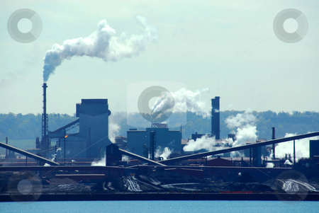 To use this stock image in your creative project, please select the size you need over to the right and click the "Add to Cart" button.
Your downloaded image will come with the Cutcaster watermark removed so don’t worry about the watermark you see on this page. Industrial pollution stock photo, Steel mill industrial pollution by Elena Elisseeva