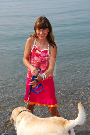 To use this stock image in your creative project, please select the size you need over to the right and click the "Add to Cart" button.
Your downloaded image will come with the Cutcaster watermark removed so don’t worry about the watermark you see on this page. Girl playing dog stock photo, Happy girl playing with her dog in water by Elena Elisseeva