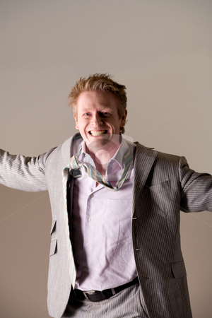 To use this stock image in your creative project, please select the size you need over to the right and click the "Add to Cart" button.
Your downloaded image will come with the Cutcaster watermark removed so don’t worry about the watermark you see on this page. Middleaged business man with loose tie stock photo, Studio portrait of a middleaged man looking very happy with a loose tie. by Frenk and Danielle Kaufmann