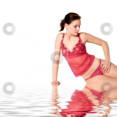 To use this stock image in your creative project, please select the size you need over to the right and click the "Add to Cart" button.
Your downloaded image will come with the Cutcaster watermark removed so don’t worry about the watermark you see on this page. Woman in red lingerie sitting relaxing by the pool stock photo, Studio portrait of a young woman in red lingerie by Frenk and Danielle Kaufmann