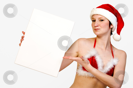 To use this stock image in your creative project, please select the size you need over to the right and click the "Add to Cart" button.
Your downloaded image will come with the Cutcaster watermark removed so don’t worry about the watermark you see on this page. Presenting Christmas space stock photo, Beautiful girl in christmas bikini and with christmas hat is holding up a white sign for copy space. With background clipping path for your convenience by Frenk and Danielle Kaufmann
