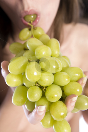 To use this stock image in your creative project, please select the size you need over to the right and click the "Add to Cart" button.
Your downloaded image will come with the Cutcaster watermark removed so don’t worry about the watermark you see on this page. Eating grapes stock photo, A woman portrait taken in the studio by Frenk and Danielle Kaufmann