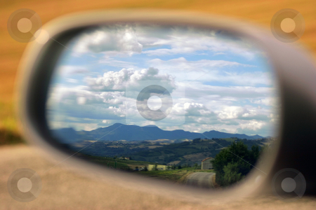 To use this stock image in your creative project, please select the size you need over to the right and click the "Add to Cart" button.
Your downloaded image will come with the Cutcaster watermark removed so don’t worry about the watermark you see on this page. Landscape in the mirror stock photo, Landscape reflected in a car's mirror by Luca Mosconi