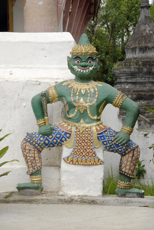To use this stock image in your creative project, please select the size you need over to the right and click the "Add to Cart" button.
Your downloaded image will come with the Cutcaster watermark removed so don’t worry about the watermark you see on this page. Buddhistic God stock photo, Buddhistic God standing next to a temple in Luang Prabang, Laos by Claudia Van Dijk