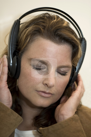 To use this stock image in your creative project, please select the size you need over to the right and click the "Add to Cart" button.
Your downloaded image will come with the Cutcaster watermark removed so don’t worry about the watermark you see on this page. Girl with headphones stock photo, Beautiful girl listening to music with headphones by Claudia Van Dijk