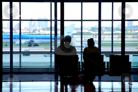 To use this stock image in your creative project, please select the size you need over to the right and click the "Add to Cart" button.
Your downloaded image will come with the Cutcaster watermark removed so don’t worry about the watermark you see on this page. Couple airport stock photo, Couple waiting at the international airport terminal by Elena Elisseeva