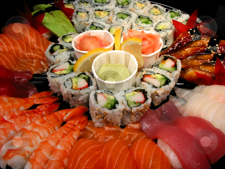 To use this stock image in your creative project, please select the size you need over to the right and click the "Add to Cart" button.
Your downloaded image will come with the Cutcaster watermark removed so don’t worry about the watermark you see on this page. Sushi party tray, closeup stock photo, Party tray of sushi and rolls, closeup by Elena Elisseeva