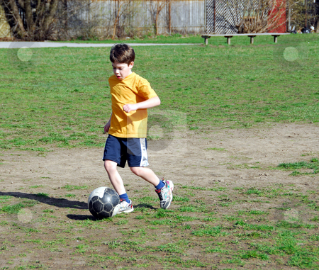 To use this stock image in your creative project, please select the size you need over to the right and click the "Add to Cart" button.
Your downloaded image will come with the Cutcaster watermark removed so don’t worry about the watermark you see on this page. Boy playing soccer stock photo, Young boy playing soccer by Elena Elisseeva