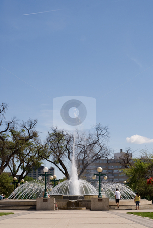To use this stock image in your creative project, please select the size you need over to the right and click the "Add to Cart" button.
Your downloaded image will come with the Cutcaster watermark removed so don’t worry about the watermark you see on this page. Fountain stock photo, A large water fountain shot during the day, with additional space for the text in the sky by Richard Nelson