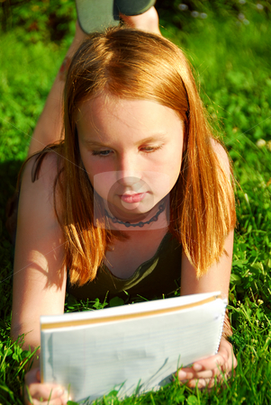 To use this stock image in your creative project, please select the size you need over to the right and click the "Add to Cart" button.
Your downloaded image will come with the Cutcaster watermark removed so don’t worry about the watermark you see on this page. Girl grass stock photo, Young girl lying on green grass outside with a notepad by Elena Elisseeva