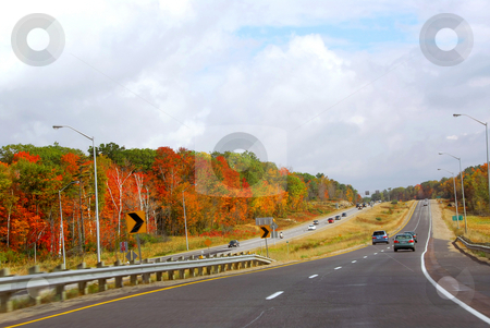 To use this stock image in your creative project, please select the size you need over to the right and click the "Add to Cart" button.
Your downloaded image will come with the Cutcaster watermark removed so don’t worry about the watermark you see on this page. Fall highway stock photo, Divided highway with traffic in the fall by Elena Elisseeva