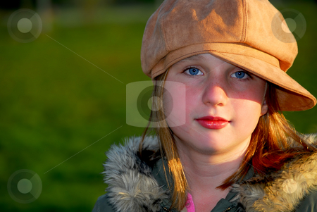 To use this stock image in your creative project, please select the size you need over to the right and click the "Add to Cart" button.
Your downloaded image will come with the Cutcaster watermark removed so don’t worry about the watermark you see on this page. Girl portrait stock photo, Portrait of a young girl wearing suede hat on green background by Elena Elisseeva