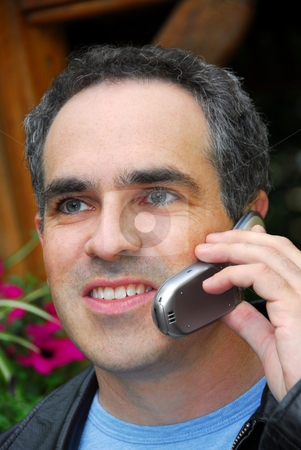 To use this stock image in your creative project, please select the size you need over to the right and click the "Add to Cart" button.
Your downloaded image will come with the Cutcaster watermark removed so don’t worry about the watermark you see on this page. Man phone stock photo, Attractive man talking on cell phone outside by Elena Elisseeva