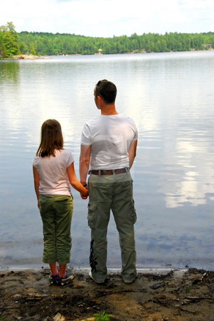 To use this stock image in your creative project, please select the size you need over to the right and click the "Add to Cart" button.
Your downloaded image will come with the Cutcaster watermark removed so don’t worry about the watermark you see on this page. Father daughter lake stock photo, Father and daughter standing on the lake shore and looking at calm water by Elena Elisseeva