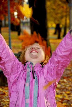 To use this stock image in your creative project, please select the size you need over to the right and click the "Add to Cart" button.
Your downloaded image will come with the Cutcaster watermark removed so don’t worry about the watermark you see on this page. Autumn girl stock photo, Portrait of a young girl throwing autumn leaves by Elena Elisseeva
