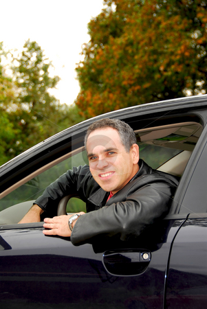 To use this stock image in your creative project, please select the size you need over to the right and click the "Add to Cart" button.
Your downloaded image will come with the Cutcaster watermark removed so don’t worry about the watermark you see on this page. Man in car stock photo, Smiling man looking from a car window by Elena Elisseeva