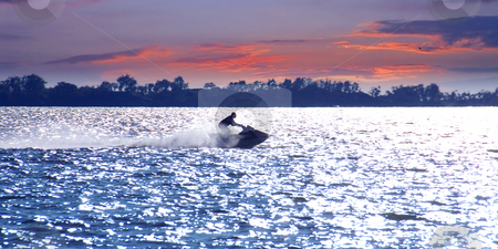 To use this stock image in your creative project, please select the size you need over to the right and click the "Add to Cart" button.
Your downloaded image will come with the Cutcaster watermark removed so don’t worry about the watermark you see on this page. Jetski stock photo, Man on jet ski at sunset by Elena Elisseeva