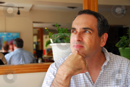 To use this stock image in your creative project, please select the size you need over to the right and click the "Add to Cart" button.
Your downloaded image will come with the Cutcaster watermark removed so don’t worry about the watermark you see on this page. Man portrait stock photo, Portrait of a man in a cafe by Elena Elisseeva