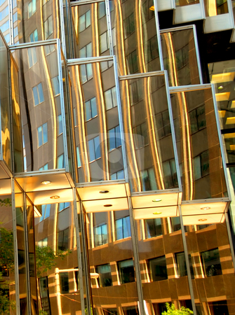 To use this stock image in your creative project, please select the size you need over to the right and click the "Add to Cart" button.
Your downloaded image will come with the Cutcaster watermark removed so don’t worry about the watermark you see on this page. Skyscraper fragment stock photo, Reflections in a golden mirror glass wall of a skyscraper by Elena Elisseeva