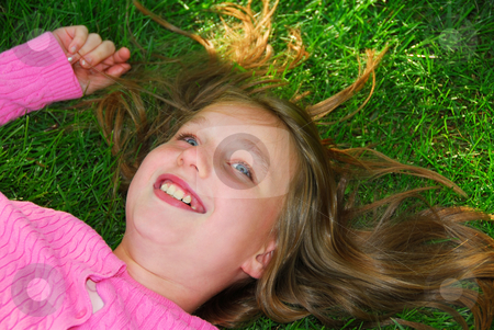 To use this stock image in your creative project, please select the size you need over to the right and click the "Add to Cart" button.
Your downloaded image will come with the Cutcaster watermark removed so don’t worry about the watermark you see on this page. Girl grass stock photo, Young girl relaxing on green grass outside by Elena Elisseeva