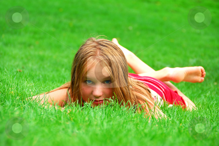 To use this stock image in your creative project, please select the size you need over to the right and click the "Add to Cart" button.
Your downloaded image will come with the Cutcaster watermark removed so don’t worry about the watermark you see on this page. Young girl grass stock photo, Young girl lying on green grass in the summer by Elena Elisseeva