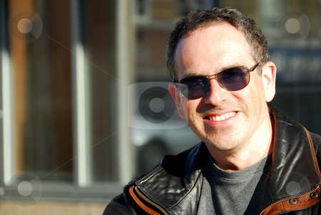 To use this stock image in your creative project, please select the size you need over to the right and click the "Add to Cart" button.
Your downloaded image will come with the Cutcaster watermark removed so don’t worry about the watermark you see on this page. Man in sunglasses stock photo, Smiling man in sunglasses by Elena Elisseeva